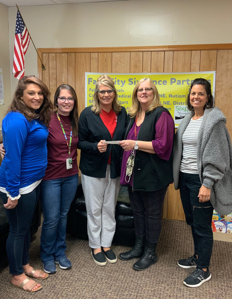 Sixpence Receives Donation from FCEA